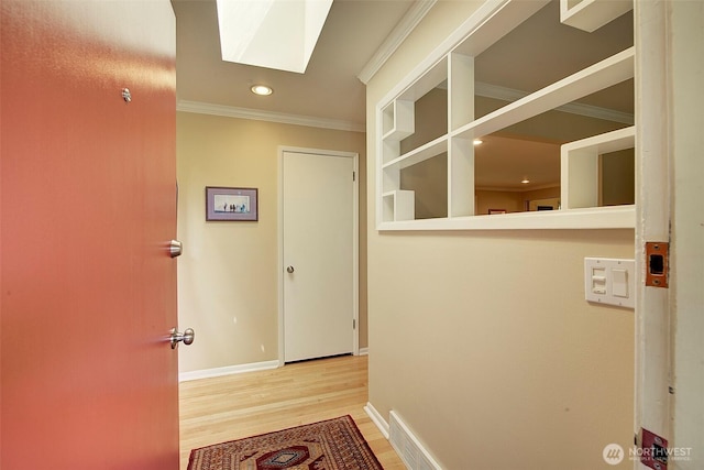 614 NW 126th Pl, Seattle, WA 98177 - corridor featuring a skylight, wood finished floors, recessed lighting, and ornamental molding