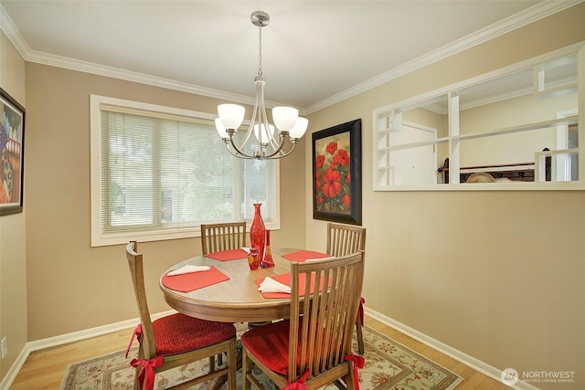 614 NW 126th Pl, Seattle, WA 98177 - dining area featuring wood finished floors, a chandelier, and ornamental molding