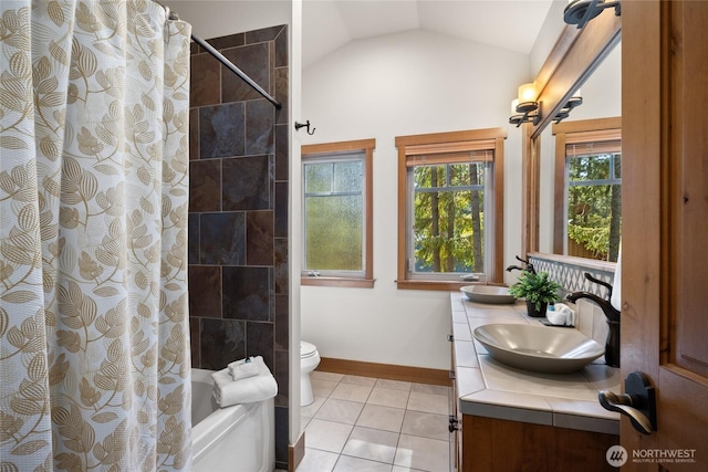 950 Coal Mine Way, Cle Elum, WA 98922 - full bathroom featuring double vanity, vaulted ceiling, shower / bath combo, tile patterned flooring, and toilet