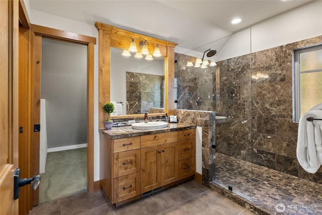 950 Coal Mine Way, Cle Elum, WA 98922 - bathroom with vanity, a tile shower, lofted ceiling, and tile patterned flooring