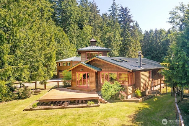 152 Richwood Ln, Lopez Island, WA 98261 - back of property with a deck, a standing seam roof, metal roof, and a garden