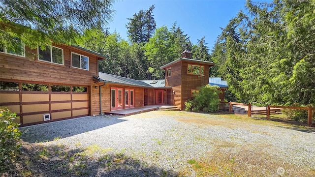152 Richwood Ln, Lopez Island, WA 98261 - view of home's exterior featuring metal roof and a chimney