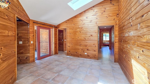 152 Richwood Ln, Lopez Island, WA 98261 - hallway with wood walls, vaulted ceiling, and a skylight