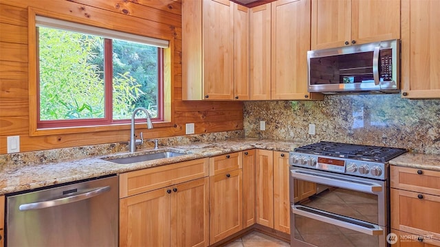 152 Richwood Ln, Lopez Island, WA 98261 - kitchen with stainless steel appliances, a sink, tasteful backsplash, and light stone counters