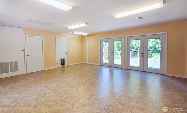 152 Richwood Ln, Lopez Island, WA 98261 - unfurnished room with french doors, healthy amount of natural light, tile patterned floors, and baseboards