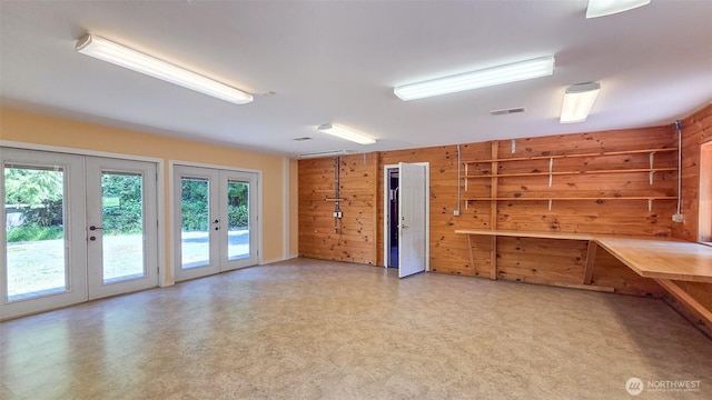 152 Richwood Ln, Lopez Island, WA 98261 - unfurnished room with french doors, wood walls, and light flooring
