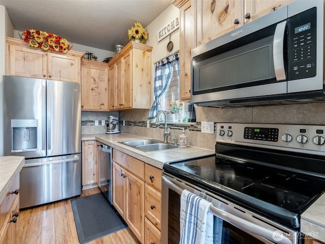 2962 26th Ave, Forest Grove, OR 97116 - kitchen with stainless steel appliances, light brown cabinets, and a sink