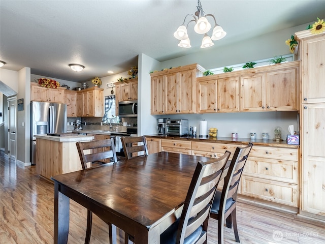 2962 26th Ave, Forest Grove, OR 97116 - dining space with light wood-style flooring and a chandelier