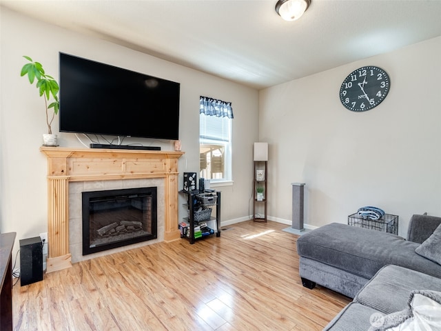 2962 26th Ave, Forest Grove, OR 97116 - living area with a fireplace, wood finished floors, and baseboards