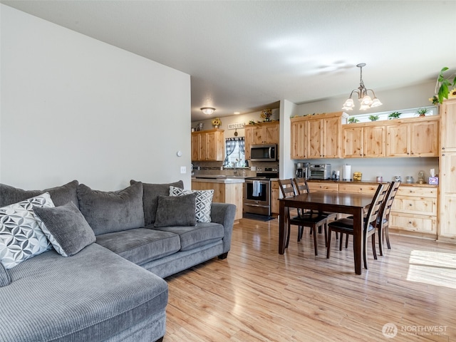 2962 26th Ave, Forest Grove, OR 97116 - living room with a chandelier and light wood finished floors