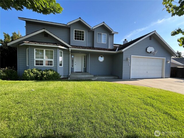 1516 4th St, Wenatchee, WA 98801 - traditional-style house with a garage, concrete driveway, and a front lawn