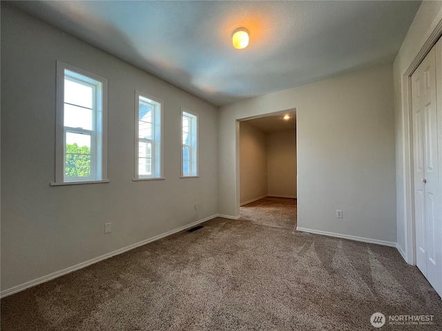 1516 4th St, Wenatchee, WA 98801 - unfurnished bedroom with carpet flooring, baseboards, and a closet