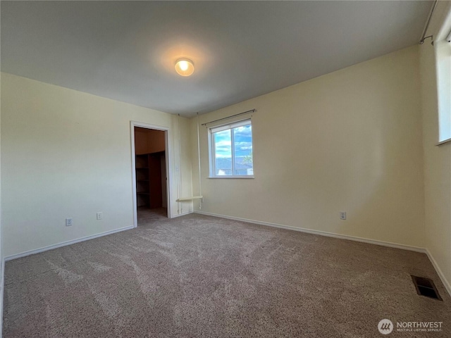 1516 4th St, Wenatchee, WA 98801 - unfurnished bedroom with carpet flooring, baseboards, and a spacious closet