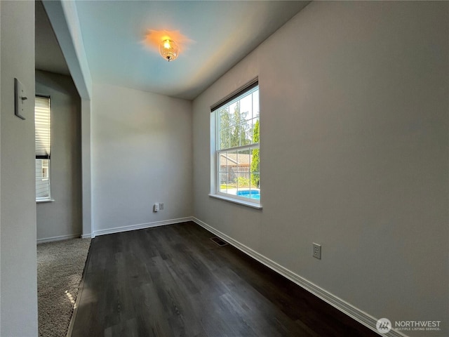 1516 4th St, Wenatchee, WA 98801 - unfurnished room featuring baseboards and dark wood finished floors