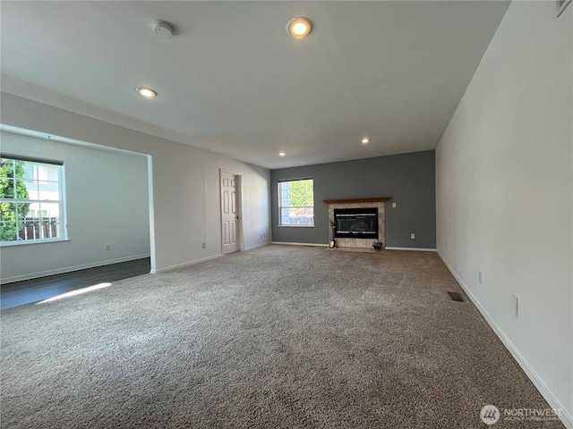 1516 4th St, Wenatchee, WA 98801 - unfurnished living room with carpet floors, recessed lighting, baseboards, and a fireplace