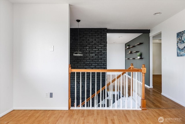 13371 Eagle St, Anacortes, WA 98221 - hallway featuring an upstairs landing, baseboards, and wood finished floors