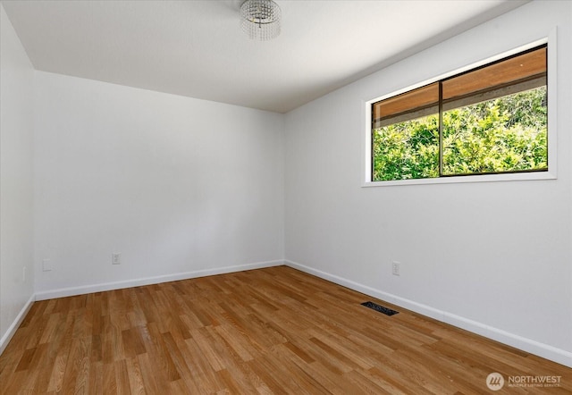 13371 Eagle St, Anacortes, WA 98221 - empty room with wood finished floors and baseboards