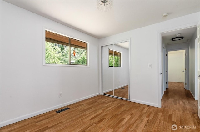 13371 Eagle St, Anacortes, WA 98221 - unfurnished bedroom with light wood-style floors, baseboards, and a closet