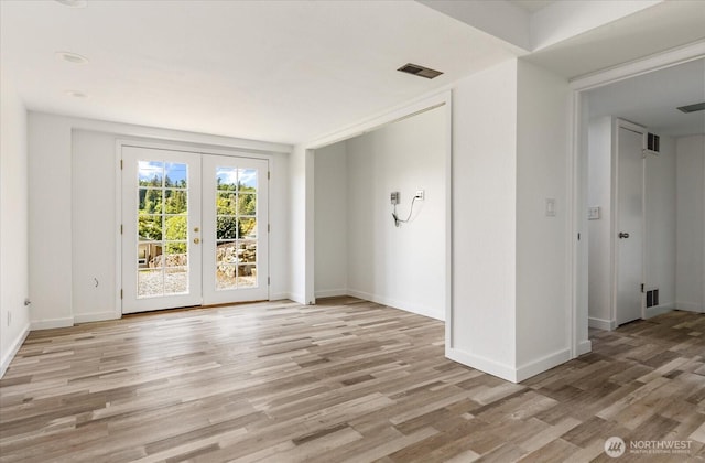 13371 Eagle St, Anacortes, WA 98221 - unfurnished room with french doors, light wood-style flooring, and baseboards