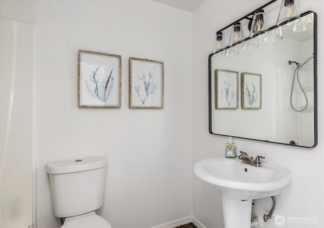 13371 Eagle St, Anacortes, WA 98221 - bathroom featuring a shower, toilet, and baseboards