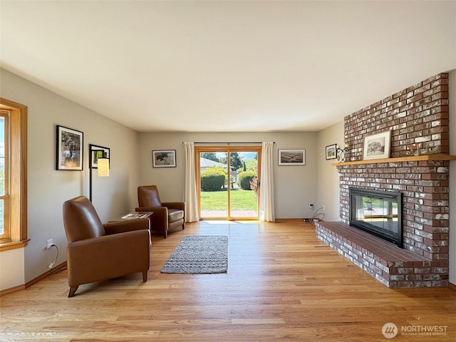 22 E Bedinger Rd, Sequim, WA 98382 - living room featuring wood finished floors, a fireplace, and baseboards