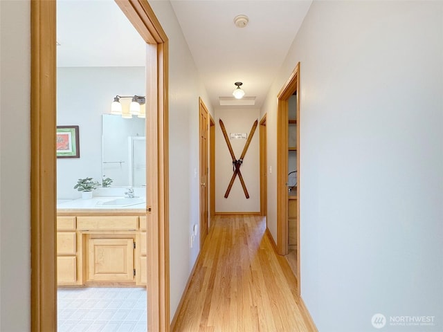 22 E Bedinger Rd, Sequim, WA 98382 - hallway featuring a sink and light wood-style floors