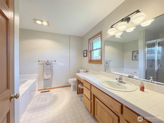 22 E Bedinger Rd, Sequim, WA 98382 - full bathroom with a bath, a shower stall, vanity, toilet, and tile patterned floors