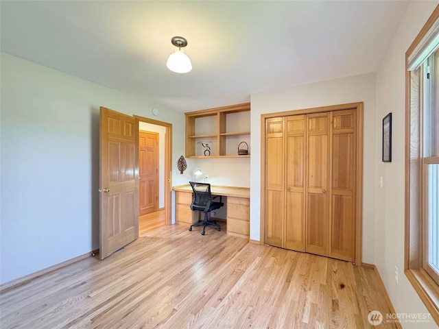 22 E Bedinger Rd, Sequim, WA 98382 - office area featuring light wood-type flooring, built in study area, and baseboards