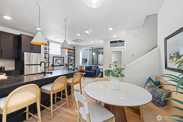 1134 32nd Ave E Unit B, Seattle, WA 98112 - dining space with light wood-type flooring and recessed lighting