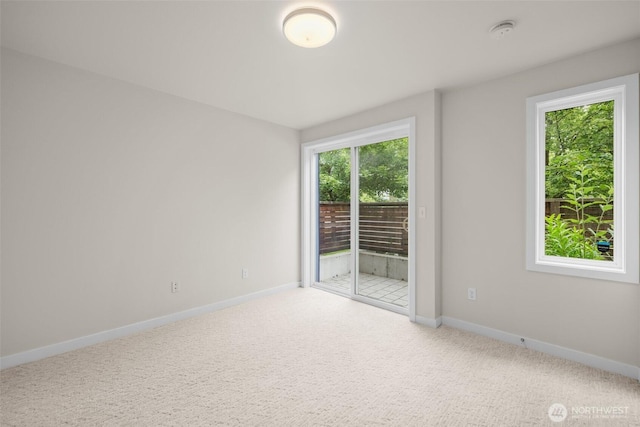 5915 Fauntleroy Way SW Unit C, Seattle, WA 98136 - carpeted empty room featuring baseboards and a smoke detector