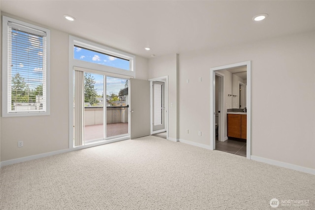 5915 Fauntleroy Way SW Unit C, Seattle, WA 98136 - unfurnished bedroom featuring access to outside, carpet floors, recessed lighting, and baseboards