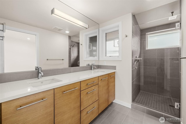 5915 Fauntleroy Way SW Unit C, Seattle, WA 98136 - bathroom with double vanity, a shower stall, tile patterned flooring, and baseboards