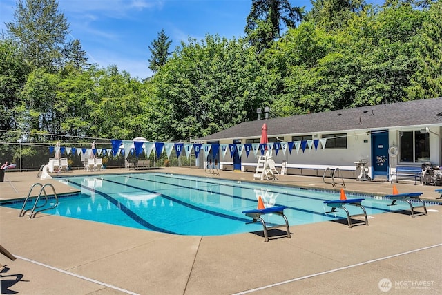14318 117th Pl NE, Kirkland, WA 98034 - community pool featuring a patio area and view of scattered trees