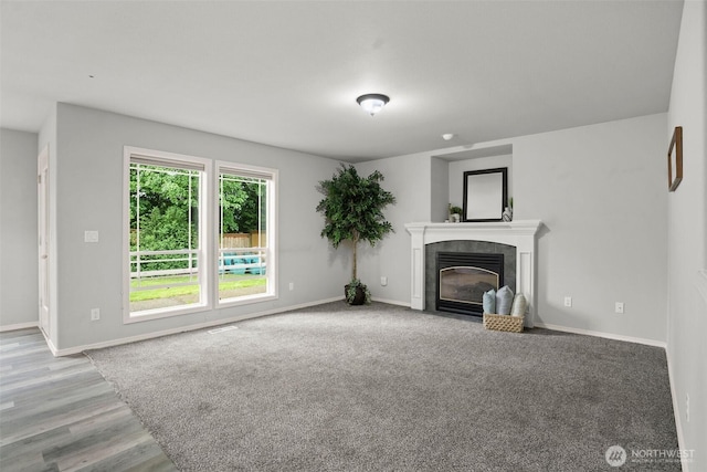 2804 177th, Vancouver, WA 98682 - unfurnished living room with a tiled fireplace, baseboards, and light wood-style flooring