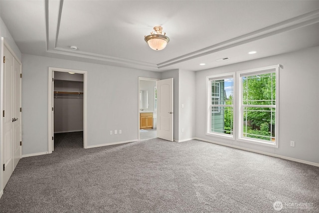 2804 177th, Vancouver, WA 98682 - unfurnished bedroom featuring carpet, baseboards, a walk in closet, a tray ceiling, and recessed lighting