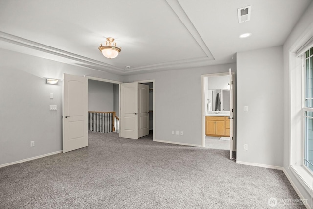 2804 177th, Vancouver, WA 98682 - unfurnished bedroom featuring a raised ceiling, carpet, baseboards, and a walk in closet