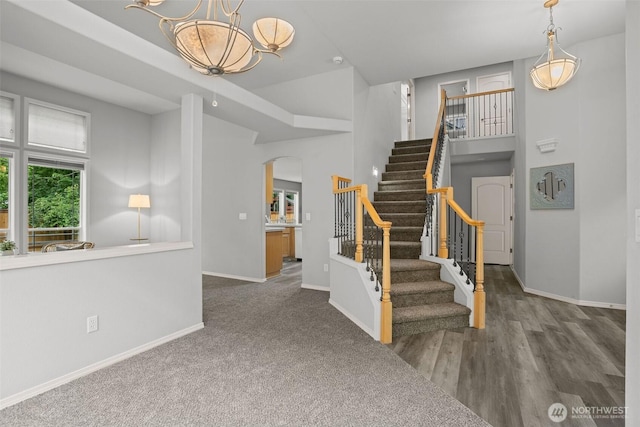 2804 177th, Vancouver, WA 98682 - foyer entrance featuring arched walkways, baseboards, a chandelier, stairs, and a towering ceiling