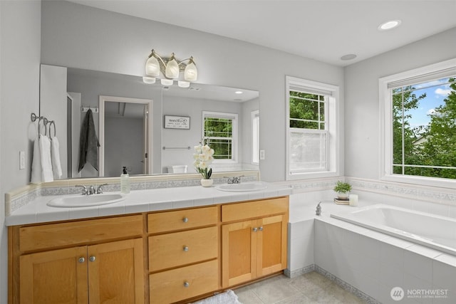 2804 177th, Vancouver, WA 98682 - bathroom with double vanity, a garden tub, tile patterned flooring, and recessed lighting