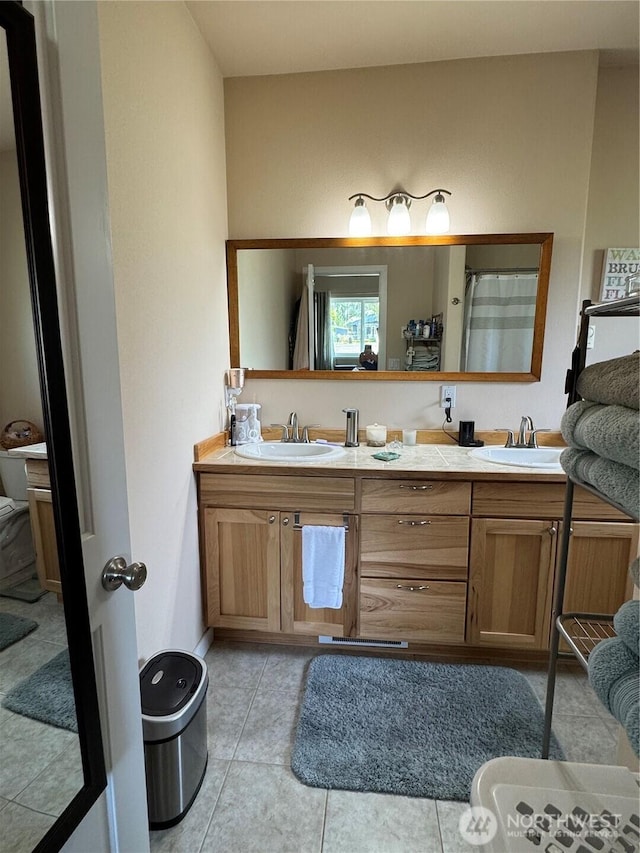 851 Heichel Rd, Camano Island, WA 98282 - full bath featuring double vanity, tile patterned floors, and toilet