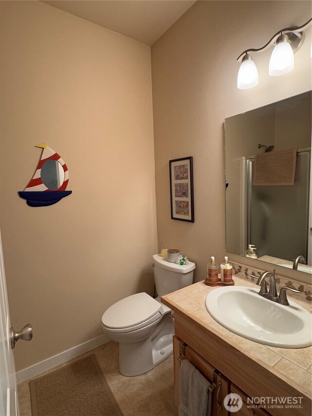 851 Heichel Rd, Camano Island, WA 98282 - full bath featuring vanity, toilet, a shower with shower door, and tile patterned flooring