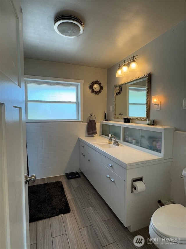 851 Heichel Rd, Camano Island, WA 98282 - bathroom with toilet, vanity, and wood tiled floors