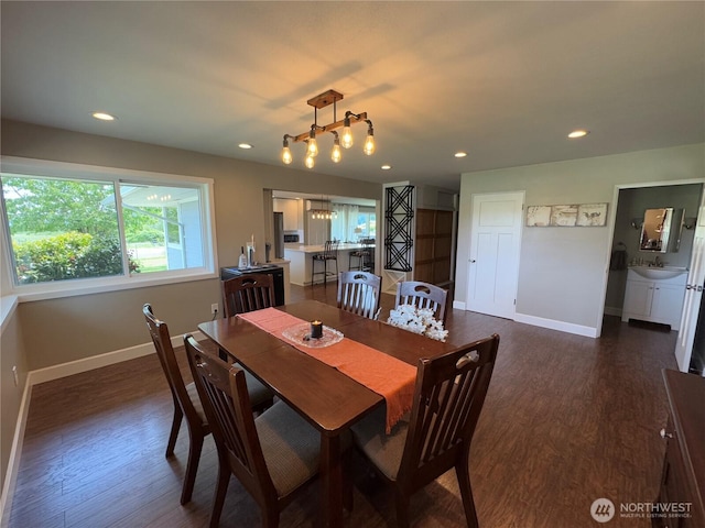 851 Heichel Rd, Camano Island, WA 98282 - dining space with baseboards, dark wood-type flooring, recessed lighting, and a chandelier