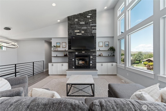 1425 Appleridge St, Wenatchee, WA 98801 - living room featuring a chandelier, baseboards, high vaulted ceiling, a large fireplace, and recessed lighting