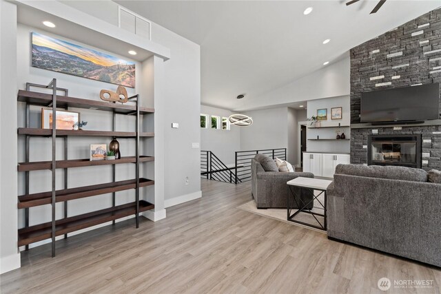 1425 Appleridge St, Wenatchee, WA 98801 - living area with vaulted ceiling, wood finished floors, a fireplace, and baseboards
