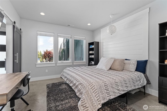 1425 Appleridge St, Wenatchee, WA 98801 - bedroom featuring baseboards, a barn door, recessed lighting, and concrete floors
