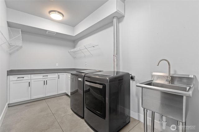 1425 Appleridge St, Wenatchee, WA 98801 - laundry area featuring washer and dryer, cabinet space, light tile patterned floors, and baseboards