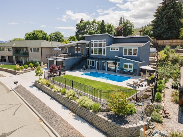 1425 Appleridge St, Wenatchee, WA 98801 - rear view of house with stairway, a fenced backyard, and concrete driveway