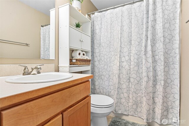 7382 Halibut Dr, Blaine, WA 98230 - bathroom with vanity, toilet, and curtained shower