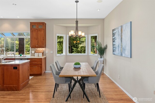 1805 179th Pl NE, Bellevue, WA 98008 - dining space with light wood-style floors, a chandelier, recessed lighting, and baseboards