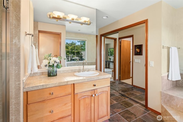 1805 179th Pl NE, Bellevue, WA 98008 - full bathroom featuring vanity, stone finish flooring, and baseboards